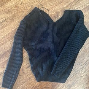 Black sweater with a knot in the back
